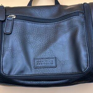 Black Toiletry Bag with Leather Texture and Zipper Closure